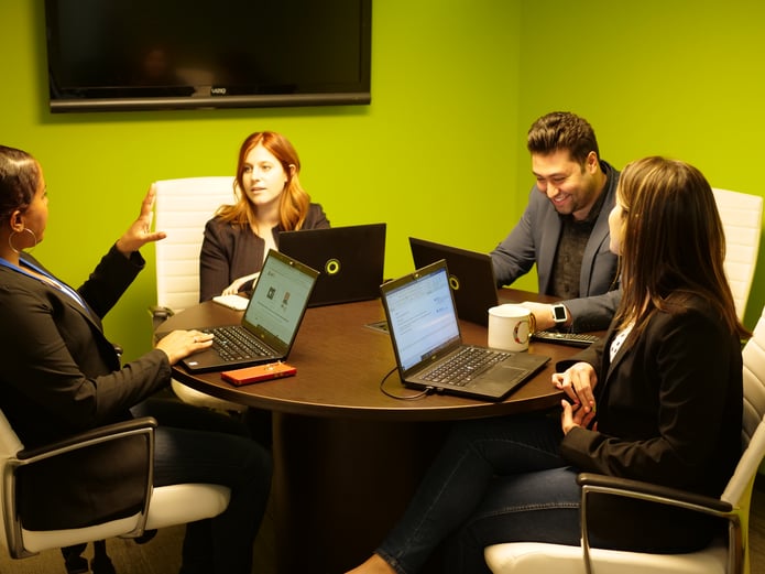 4 people in meeting room