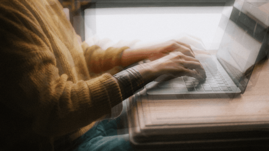 person typing on computer